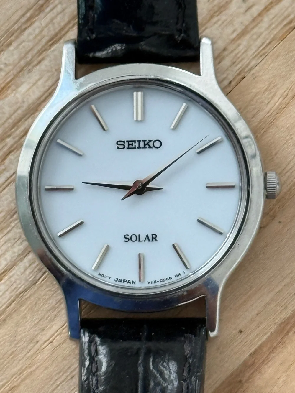 Seiko Solar Ladies Watch White Round Dial Black Leather Strap Stainless Case